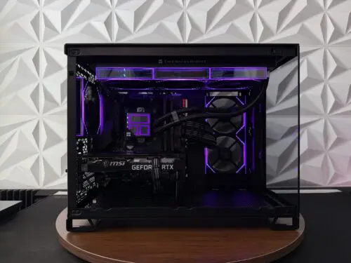 DKBPC Core PC custom gaming desktop with Intel Core i7-9700K, MSI GeForce RTX 3060 Ti, purple RGB lighting, and tempered glass side panel.