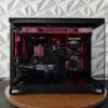 DKBPC Core PC gaming computer with red RGB lighting, MSI GeForce RTX 3060 Ti graphics card, and clean custom cable management.