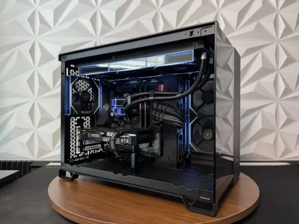 Front angled view of the DKBPC Core PC with tempered glass panels, RGB lighting, Thermalright liquid cooler, and MSI RTX 3060 Ti graphics card.