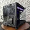 Rear view of the DKBPC Core PC showing motherboard rear I/O, MSI RTX 3060 Ti display outputs, and ventilated chassis.