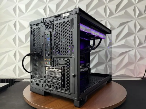 Rear view of the DKBPC Core PC showing motherboard rear I/O, MSI RTX 3060 Ti display outputs, and ventilated chassis.