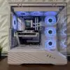 DKBPC Signature PC featuring AMD Ryzen 7 7800X3D and NVIDIA GeForce RTX 5060 in a white Lian Li Vector V1000X case