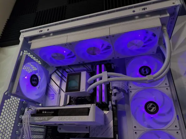 Interior close-up of the DKBPC Signature PC showing the 360mm liquid cooler, ASUS ROG Strix B650 motherboard, and DDR5 memory